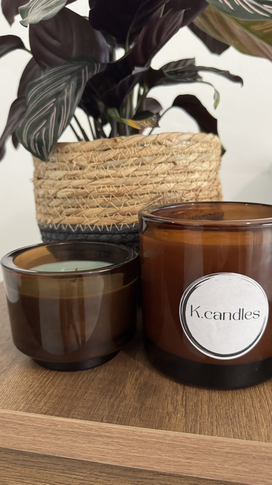 Elegant glass vessel candle with warm amber glow